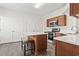 The kitchen has a stylish island with a seating area, stainless steel appliances and plenty of storage at 601 Seth Ln., Longs, SC 29568