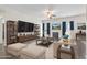 A living room with decorations and a big screen TV with dark flooring at 601 Seth Ln., Longs, SC 29568