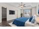 Staged main bedroom features tray ceiling, ceiling fan and large window at 601 Seth Ln., Longs, SC 29568