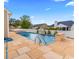 Beautiful pool with stone accents and a waterfall feature, perfect for relaxation and enjoyment during warm days at 601 Seth Ln., Longs, SC 29568