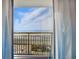 Ocean view framed by curtains and balcony railing at 7200 N Ocean Blvd. # 1053, Myrtle Beach, SC 29572