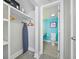 Bathroom with a toilet, sink, and closet with an ironing board at 7200 N Ocean Blvd. # 1053, Myrtle Beach, SC 29572