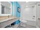 Comfortable bath and shower with granite vanity and light turquoise walls at 7200 N Ocean Blvd. # 1053, Myrtle Beach, SC 29572