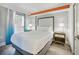 Bright bedroom with a king bed, side table and access to a balcony at 7200 N Ocean Blvd. # 1053, Myrtle Beach, SC 29572