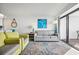 Inviting living room with stylish seating, beachy decor, and sliding glass doors to a balcony offering ocean views at 7200 N Ocean Blvd. # 1053, Myrtle Beach, SC 29572
