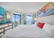 Ocean-view main bedroom has a private balcony, bright decor, and a serene atmosphere for restful nights at 7200 N Ocean Blvd. # 1053, Myrtle Beach, SC 29572