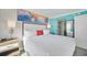 Comfortable main bedroom boasts a king bed, sliding glass doors to the private balcony, and modern decor at 7200 N Ocean Blvd. # 1053, Myrtle Beach, SC 29572