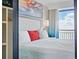 Comfortable main bedroom boasts ocean views and private balcony access, providing a serene retreat at 7200 N Ocean Blvd. # 1053, Myrtle Beach, SC 29572