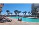 Resort pool with deck chairs and palm trees at 7200 N Ocean Blvd. # 1053, Myrtle Beach, SC 29572