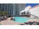 Exterior view of the resort pool with lounge chairs at 7200 N Ocean Blvd. # 1053, Myrtle Beach, SC 29572