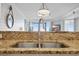 Granite countertops and a stainless steel sink in the kitchen at 7200 N Ocean Blvd. # 1053, Myrtle Beach, SC 29572
