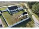 Expansive aerial view of the property including the residence, outbuildings, patio and yard at 7473 Louisville Rd., Aynor, SC 29511