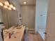 Bathroom features a large mirror, shower, and bathtub at 7473 Louisville Rd., Aynor, SC 29511