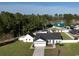 Aerial view showcasing a lovely home with a well-kept yard and separate garage at 7473 Louisville Rd., Aynor, SC 29511