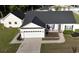Beautiful home featuring a large driveway and a well-manicured front yard at 7473 Louisville Rd., Aynor, SC 29511