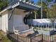 Exterior features of the building include a pergola, swing, garden, brick base, and black fence at 7473 Louisville Rd., Aynor, SC 29511