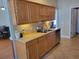 Kitchen area offers stainless steel appliances and light oak cabinets at 7473 Louisville Rd., Aynor, SC 29511