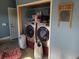 The laundry room has new washer and dryer with blue paint at 7473 Louisville Rd., Aynor, SC 29511