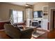 Comfortable living room features a cozy fireplace and built-in shelving at 7473 Louisville Rd., Aynor, SC 29511