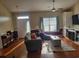 Bright living room with ample seating and a built-in entertainment center at 7473 Louisville Rd., Aynor, SC 29511