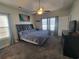 Spacious main bedroom with a ceiling fan and natural lighting at 7473 Louisville Rd., Aynor, SC 29511