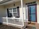 Inviting front porch features stylish decor and a welcoming atmosphere at 7473 Louisville Rd., Aynor, SC 29511
