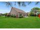 Manicured backyard with green grass and mature landscaping at 826 Sand Binder Dr., Myrtle Beach, SC 29579