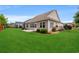 Landscaped backyard with patio, green lawn, and privacy fence at 826 Sand Binder Dr., Myrtle Beach, SC 29579