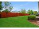 Backyard with lush green grass and newly installed privacy fence at 826 Sand Binder Dr., Myrtle Beach, SC 29579