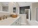 Bathroom with marble countertops, modern fixtures, and decorative backsplash at 826 Sand Binder Dr., Myrtle Beach, SC 29579