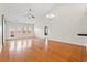 Bright, spacious living room featuring beautiful hardwood floors, vaulted ceilings, and a ceiling fan at 826 Sand Binder Dr., Myrtle Beach, SC 29579