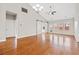 Spacious living room with hardwood floors, vaulted ceilings, and sliding barn doors leading to another room at 826 Sand Binder Dr., Myrtle Beach, SC 29579