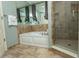 Bathroom featuring tub with shower and tiled floor at 100 North Beach Blvd. # 1704, North Myrtle Beach, SC 29582