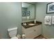 Stylish bathroom showcasing a granite countertop vanity, fresh towels, and a modern toilet at 100 North Beach Blvd. # 1704, North Myrtle Beach, SC 29582
