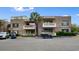 Two-story brick condo building featuring parking for golf carts at 10100 Lakeshore Dr. # C-1, Myrtle Beach, SC 29572