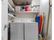 Functional laundry room with washer, dryer, shelves for storage and utility items at 10100 Lakeshore Dr. # C-1, Myrtle Beach, SC 29572