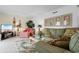 Comfortable living room with a large couch, patterned rug and coastal decor at 10100 Lakeshore Dr. # C-1, Myrtle Beach, SC 29572
