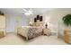 Relaxing main bedroom featuring a king-size bed, ceiling fan and closet at 10100 Lakeshore Dr. # C-1, Myrtle Beach, SC 29572