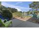 Spacious back patio with lake views featuring stone pavers, an outdoor dining set and a scenic waterfront backdrop at 105 Windsor Springs Rd., Conway, SC 29526