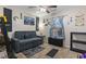 Comfortable bedroom with a pull-out couch, decorative curtains, and coastal-themed accents, creating a relaxing retreat at 105 Windsor Springs Rd., Conway, SC 29526