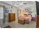 Spacious bedroom with a ceiling fan, floral bedding, and ample storage, perfect for relaxation and comfort at 105 Windsor Springs Rd., Conway, SC 29526