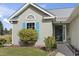 Inviting home entrance with a manicured yard, cute landscaping, and an appealing facade at 105 Windsor Springs Rd., Conway, SC 29526
