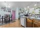 Bright kitchen with stainless steel appliances, a breakfast table, and a unique purple door, offering a blend of charm and functionality at 105 Windsor Springs Rd., Conway, SC 29526