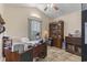 Bright home office with a large desk, ample storage, and a sunny window, creating an ideal workspace at 105 Windsor Springs Rd., Conway, SC 29526