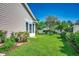 Well-maintained backyard with lush grass and manicured landscaping at 109 Pheasant Run Dr., Murrells Inlet, SC 29576