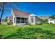 Lush backyard featuring a screened-in porch at 109 Pheasant Run Dr., Murrells Inlet, SC 29576