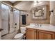 Updated bathroom features a shower-tub combo, vanity, and decorative mirror at 109 Pheasant Run Dr., Murrells Inlet, SC 29576