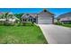 Traditional home with a two-car garage, concrete driveway, and meticulously kept lawn at 109 Pheasant Run Dr., Murrells Inlet, SC 29576