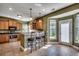 Spacious kitchen features wood cabinetry, stainless appliances, bar seating and an exterior door at 109 Pheasant Run Dr., Murrells Inlet, SC 29576