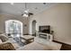 Inviting living room with a modern ceiling fan, hardwood floors, and contemporary decor at 109 Pheasant Run Dr., Murrells Inlet, SC 29576
